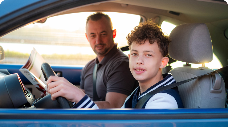 Teen learning to drive with instructor. Teen learning to drive with instructor.
